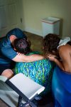 dad supporting mom during labor