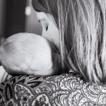 mom holding newborn baby