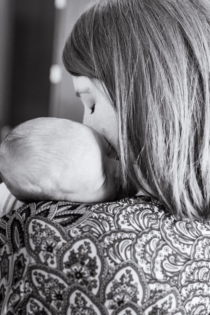 mom holding newborn baby