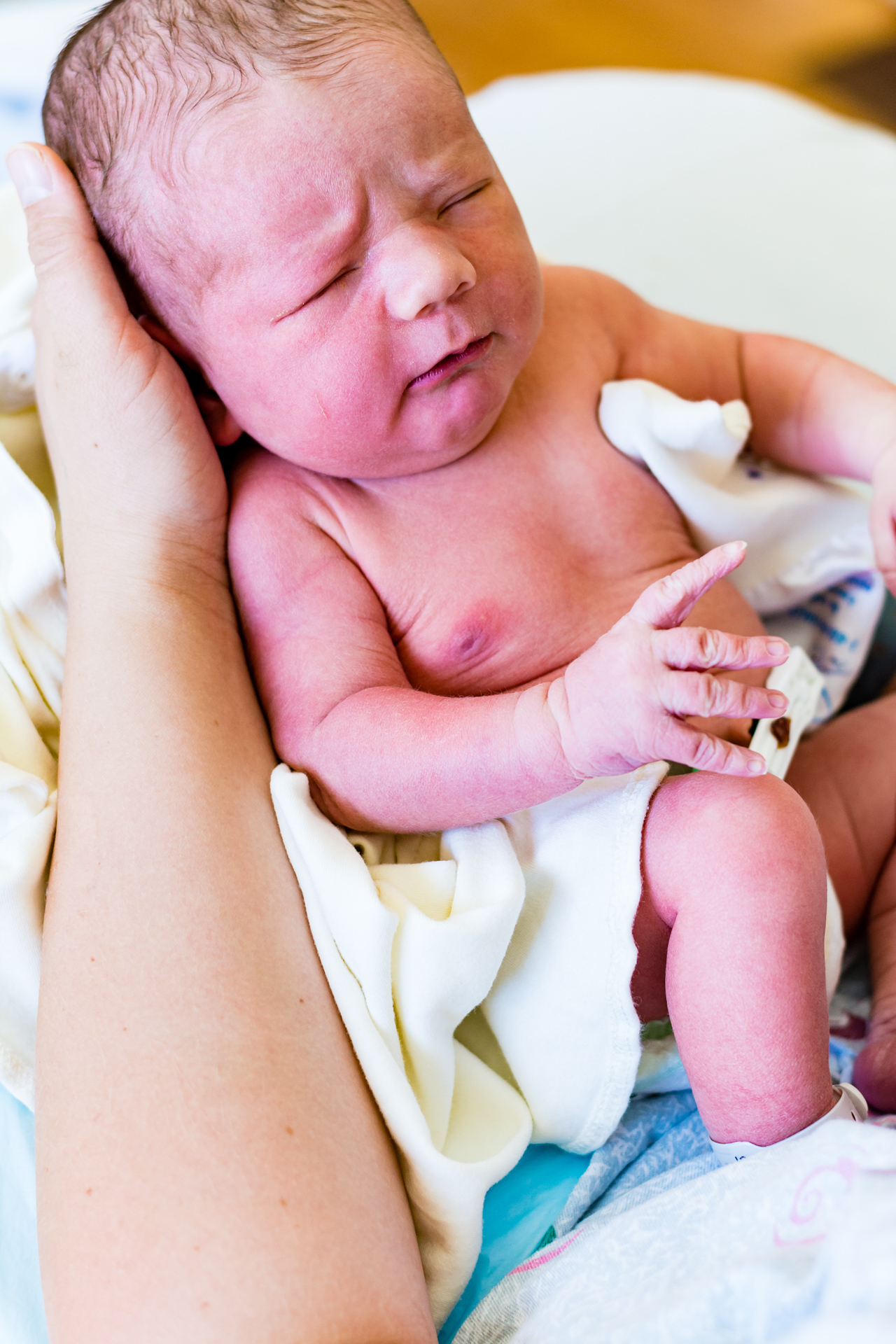 mom holding newborn baby