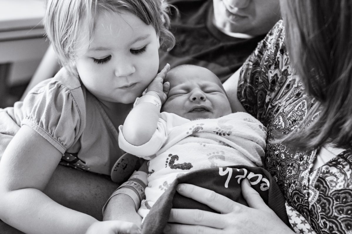 family holding newborn baby