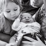 family holding newborn baby