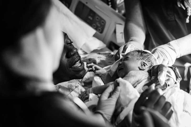 Norwood Birth-72 Women smiling at newborn baby